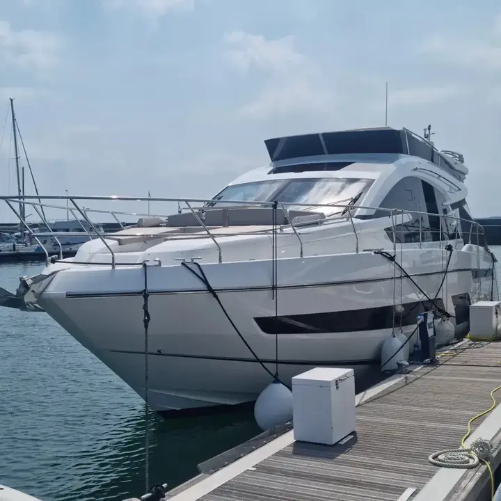 Glossy motor yacht hull after a washdown and valet